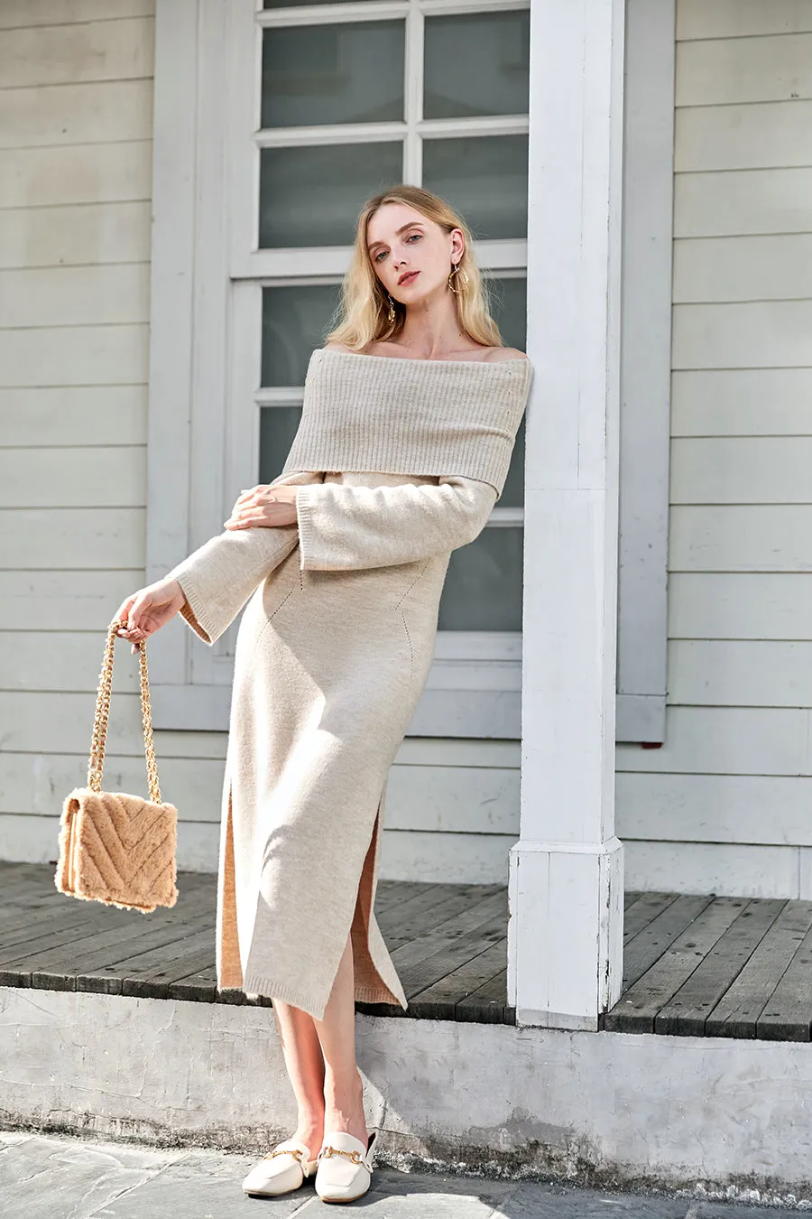 An off-the-shoulder wool knit dress