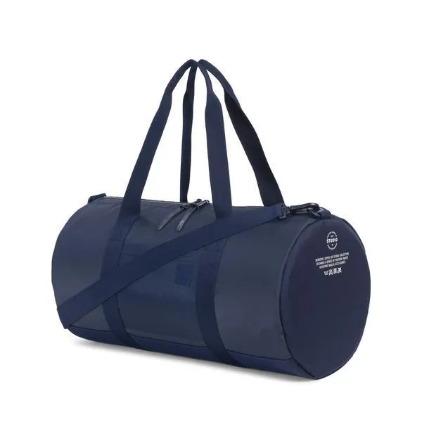HERSCHEL - SUTTON DUFFLE (PEACOAT POLYCOAT/PEACOAT)
